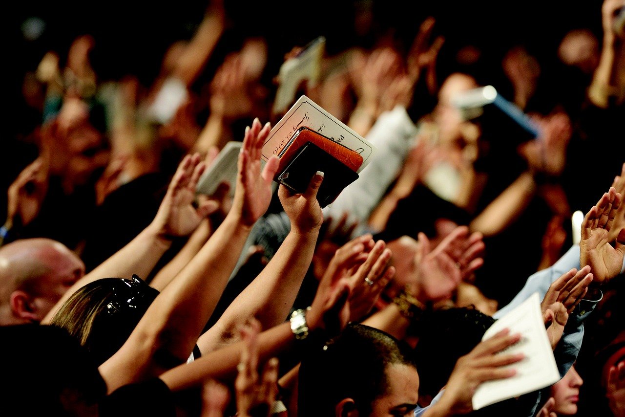 People Raising Hands in Worship